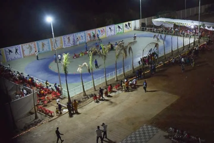 An illuminated outdoor activity area photographed in the evening