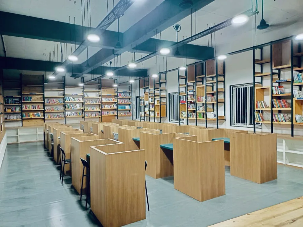 Bookshelves and individual reading desks inside the library